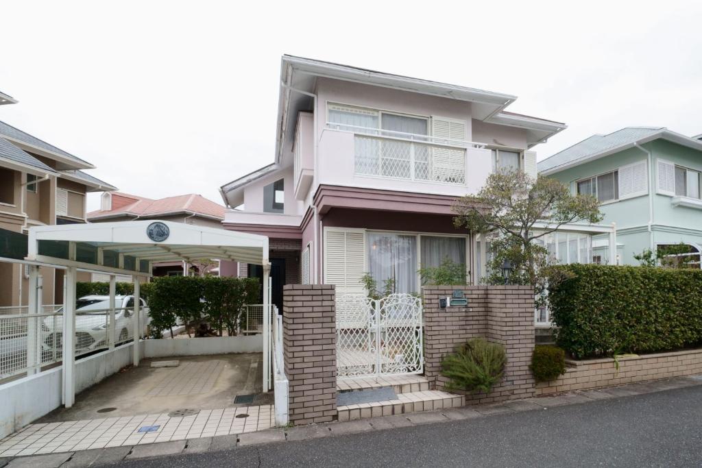 a house on a street with houses at Atagohama seaside House in Fukuoka