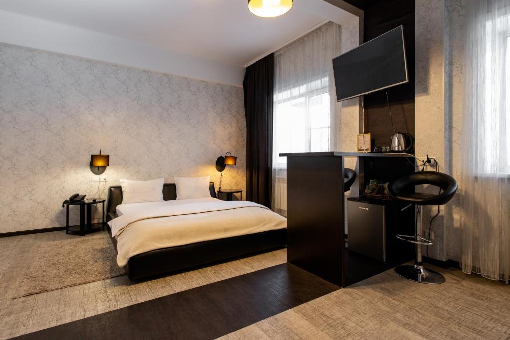 Ένα ή περισσότερα κρεβάτια σε δωμάτιο στο Hotel 7 Dorog