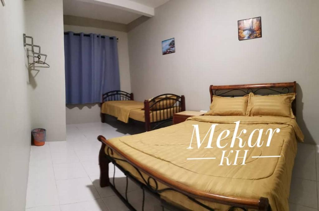 Кровать или кровати в номере Mekar KH Homestay (Muslim) @ Brinchang