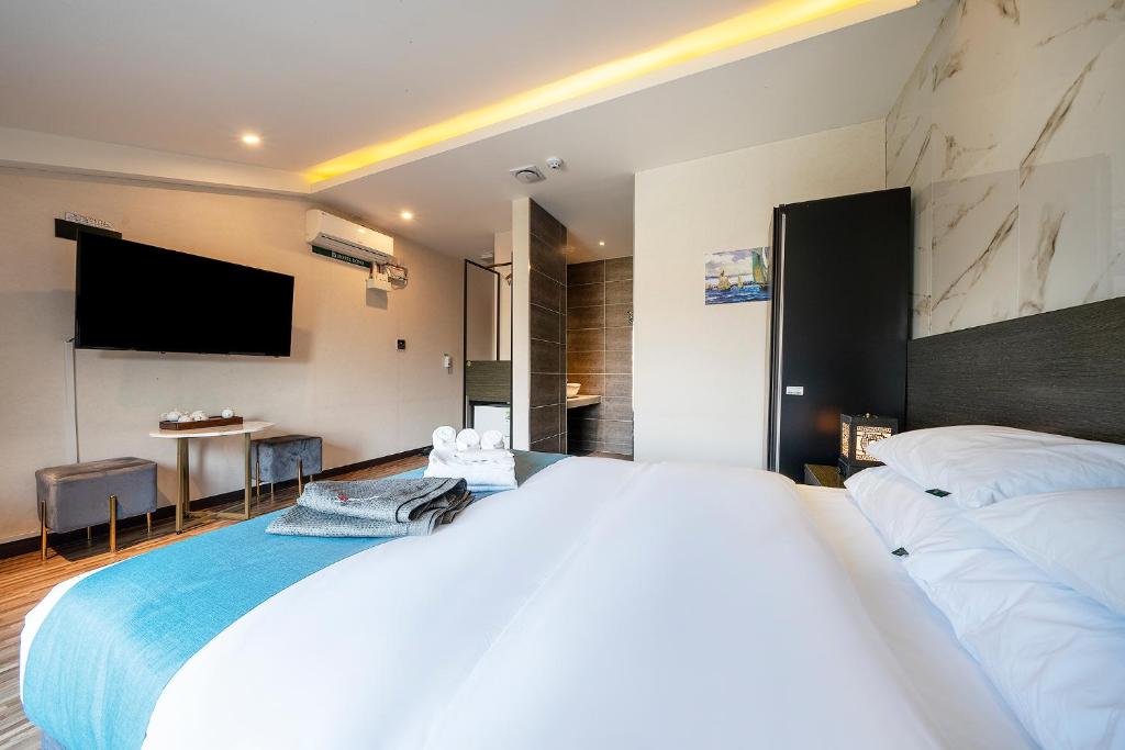 Postel nebo postele na pokoji v ubytování Suwon Dono1796 Hotel