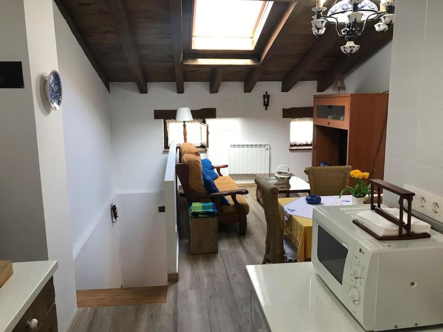 a room with a kitchen and a living room at Apartamento rustico en el Valle de Trapaga la Arboleda in La Arboleda