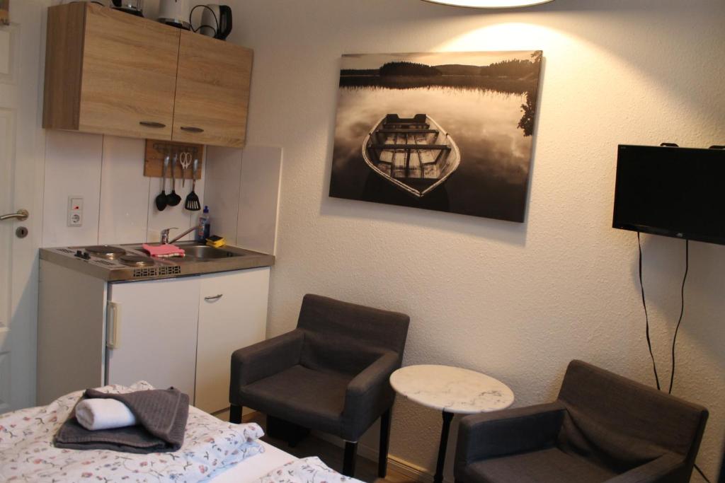 TV a/nebo společenská místnost v ubytování Apartment am Wall