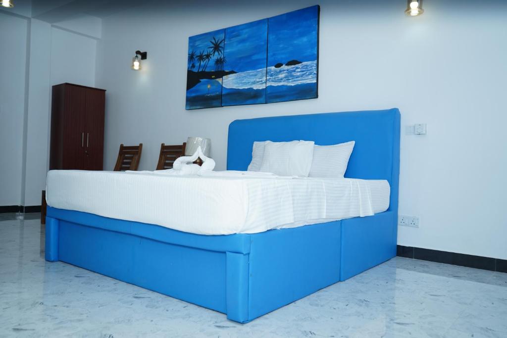 מיטה או מיטות בחדר ב-Chanro Surf Dream