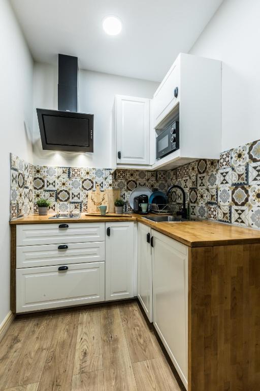 Kuchyňa alebo kuchynka v ubytovaní Apartamenty ForRest Nowotarska