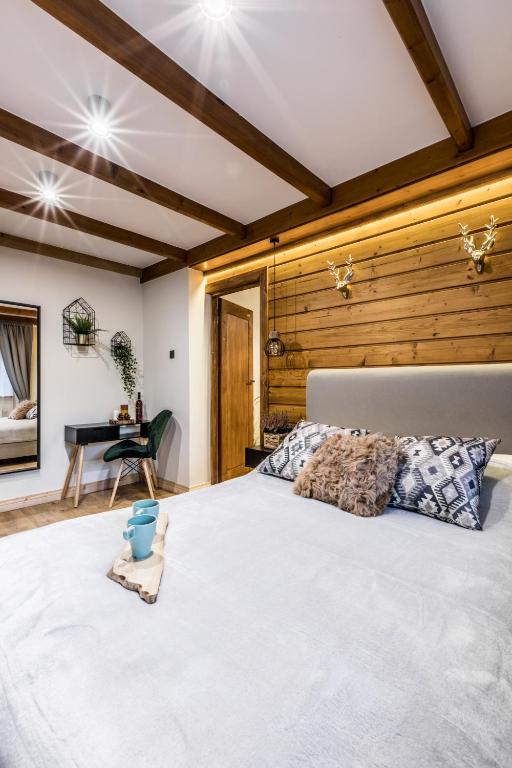 Posteľ alebo postele v izbe v ubytovaní Apartamenty ForRest Nowotarska