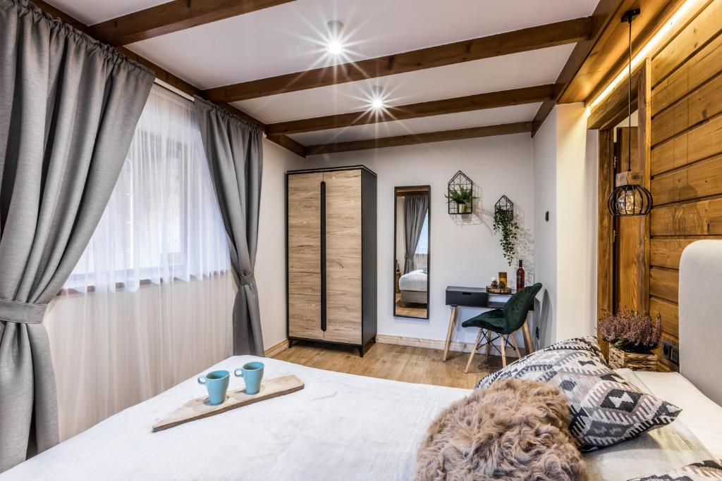 Posteľ alebo postele v izbe v ubytovaní Apartamenty ForRest Nowotarska