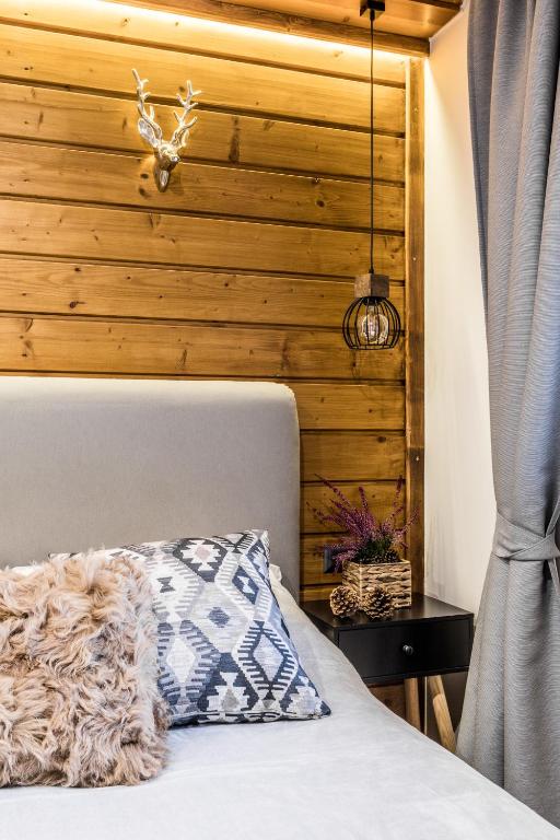 Posteľ alebo postele v izbe v ubytovaní Apartamenty ForRest Nowotarska