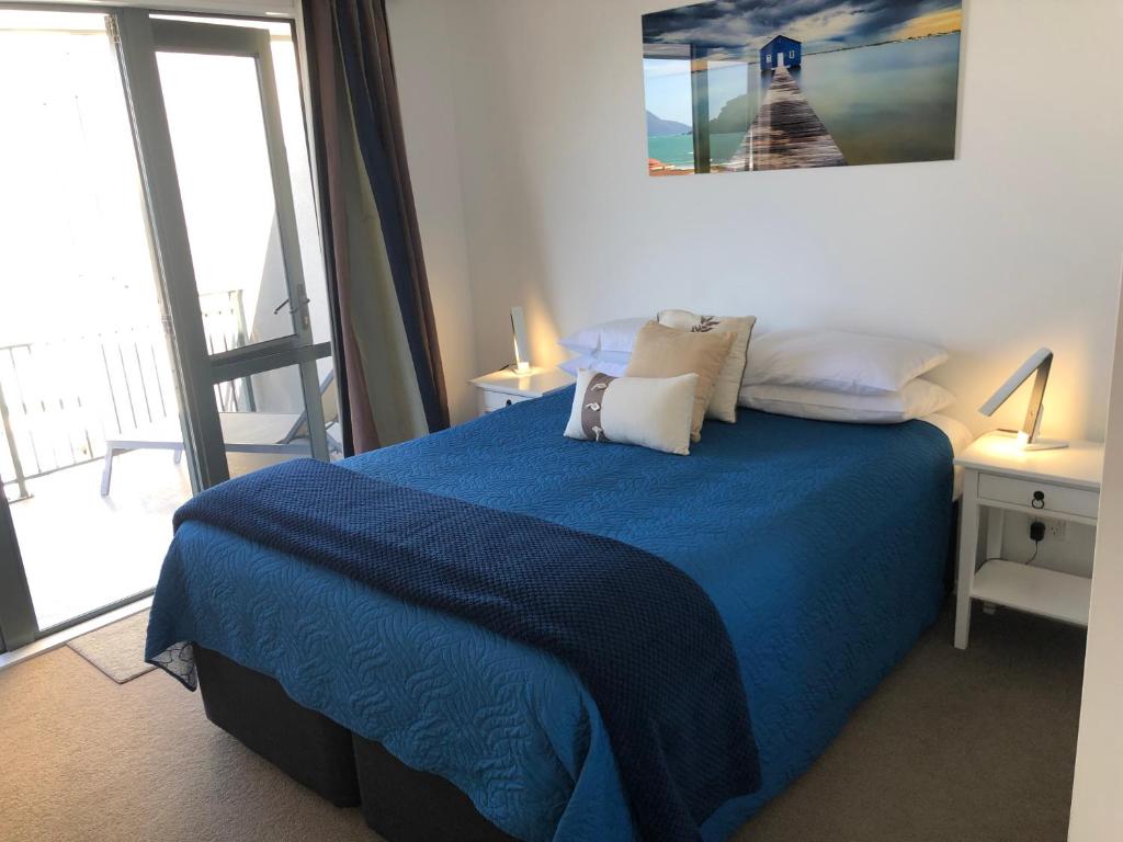Postel nebo postele na pokoji v ubytování Beachpoint Apartments