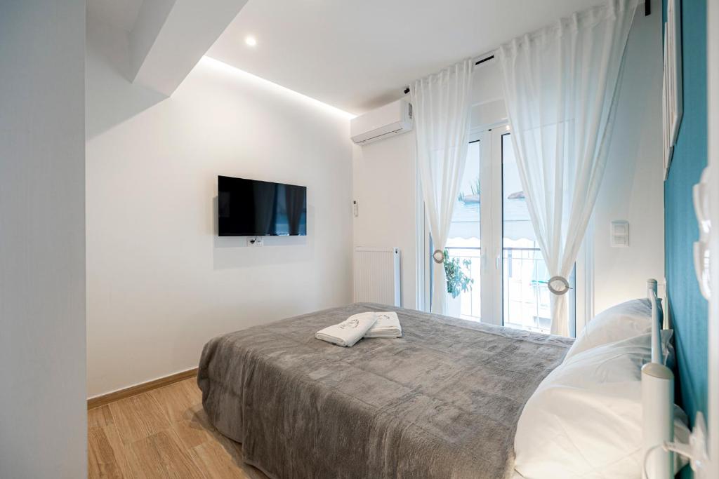 Łóżko lub łóżka w pokoju w obiekcie Aphrodite Apartment