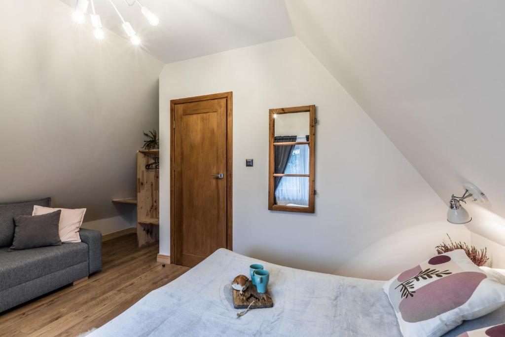 Posteľ alebo postele v izbe v ubytovaní Apartamenty ForRest Nowotarska