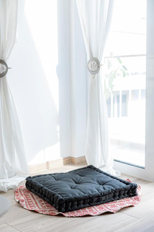 Łóżko lub łóżka w pokoju w obiekcie Aphrodite Apartment