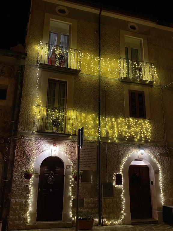 a building with christmas lights on the side of it at Holiday Home Falchetta in Palena