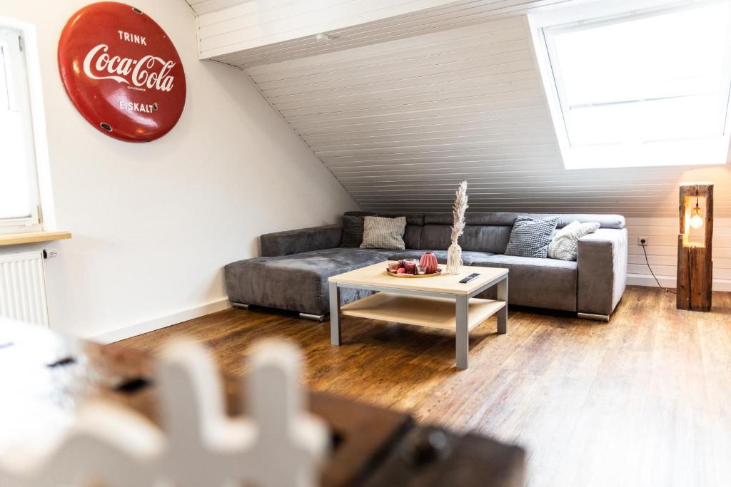 a living room with a couch and a coffee table at Ferienwohnung Kaufbeuren in Kaufbeuren