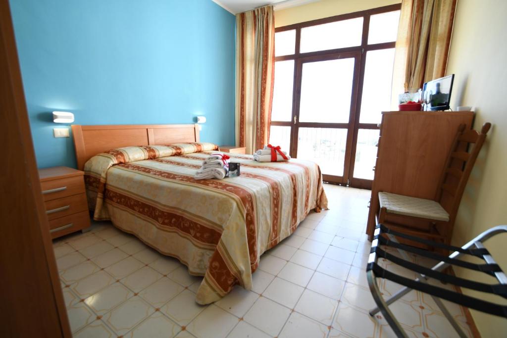 Postel nebo postele na pokoji v ubytování International Resort