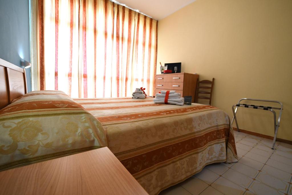 Postel nebo postele na pokoji v ubytování International Resort