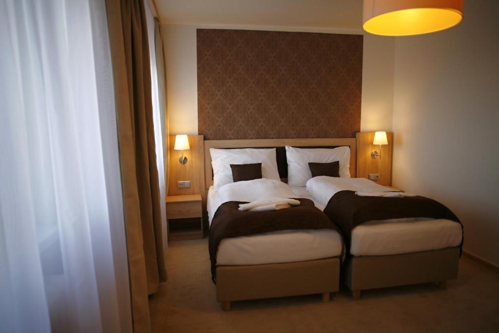 Postel nebo postele na pokoji v ubytování Hotel Pod Vlekem