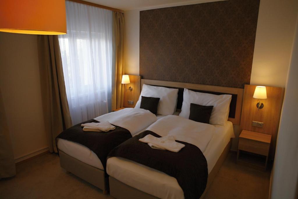 Postel nebo postele na pokoji v ubytování Hotel Pod Vlekem