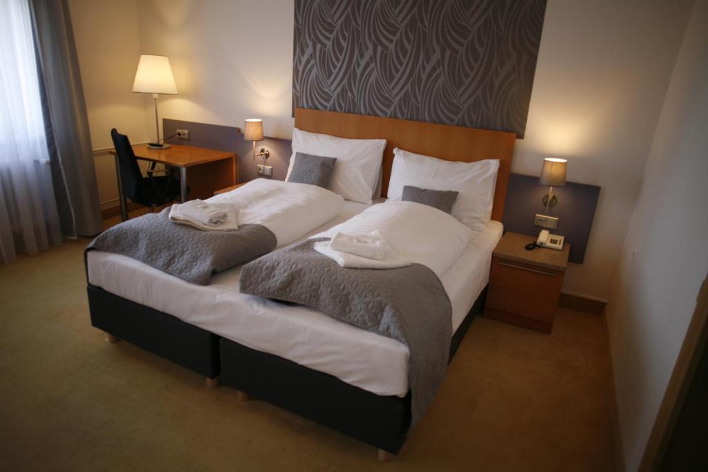 Postel nebo postele na pokoji v ubytování Hotel Pod Vlekem