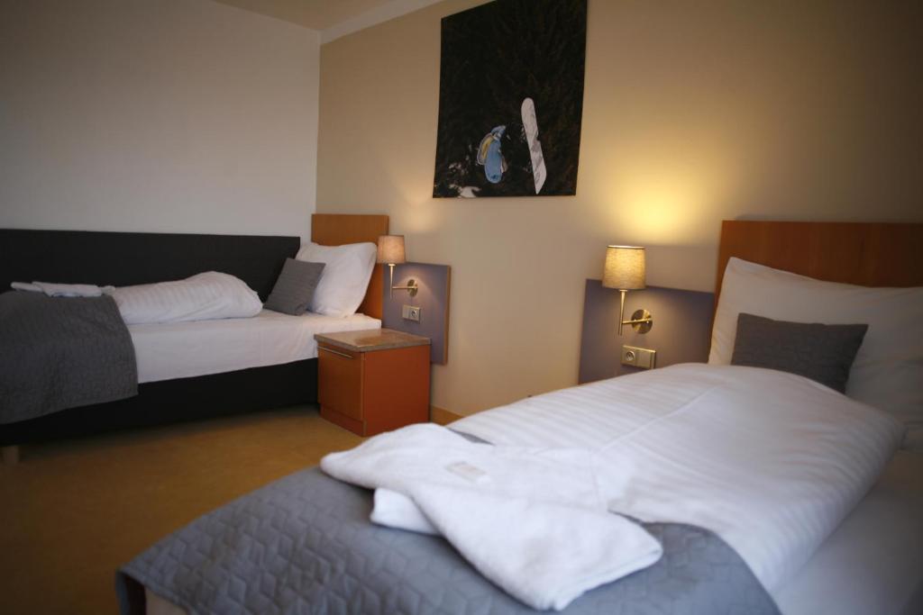 Postel nebo postele na pokoji v ubytování Hotel Pod Vlekem