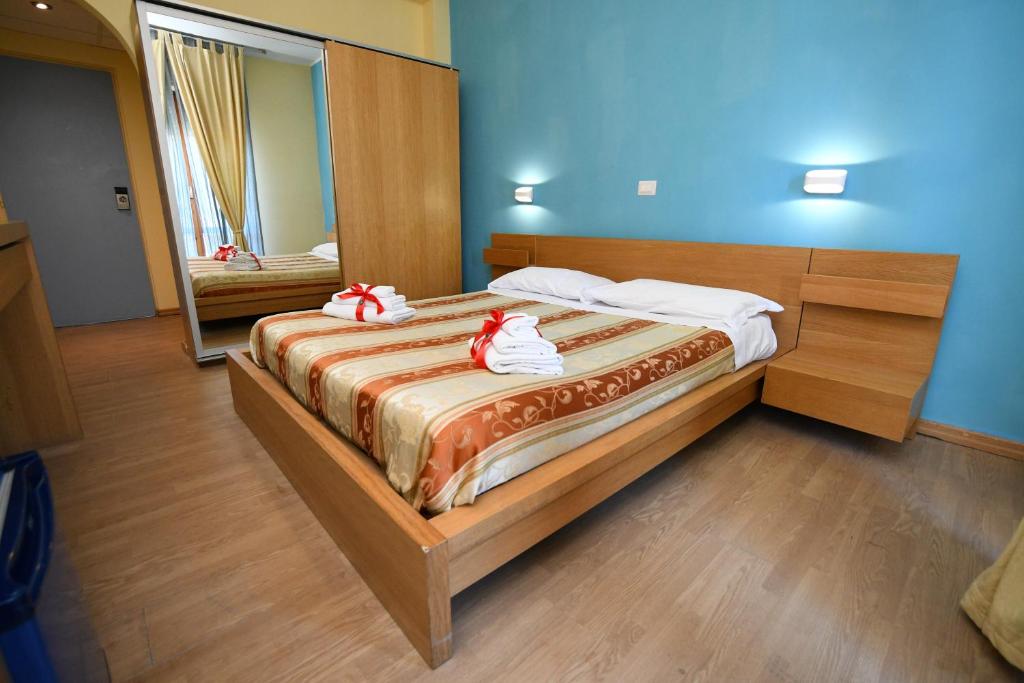 Postel nebo postele na pokoji v ubytování International Resort