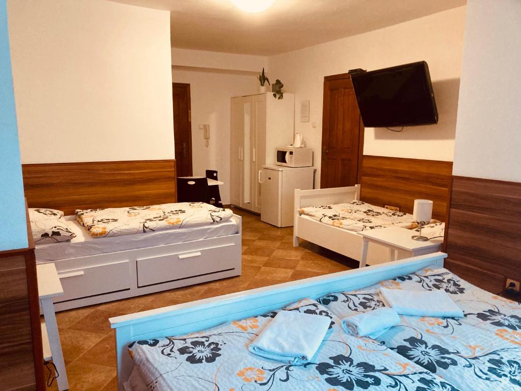 Postel nebo postele na pokoji v ubytování Penzion U Horských