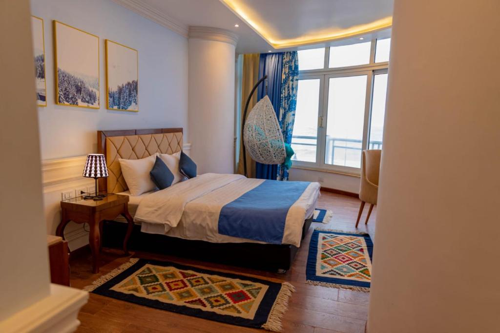 Postel nebo postele na pokoji v ubytování Miramar Boutique Hotel