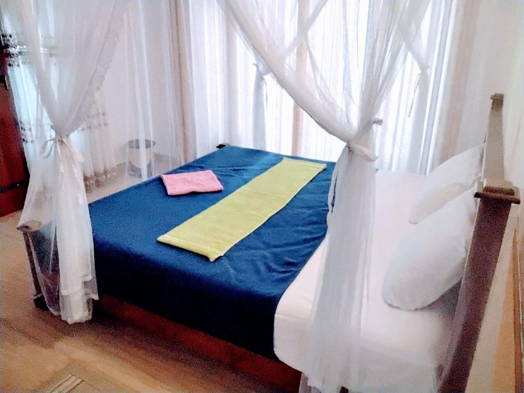 Postel nebo postele na pokoji v ubytování Ella Mount Villa