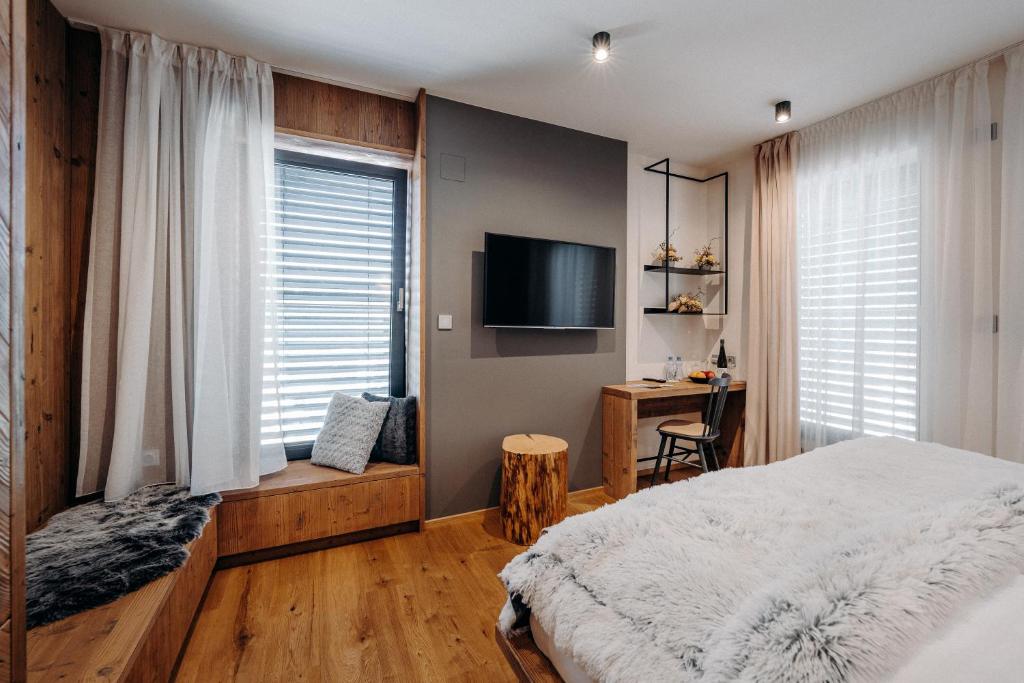 Posteľ alebo postele v izbe v ubytovaní JOHAN HOTEL