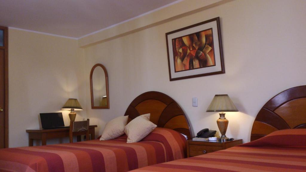 Postel nebo postele na pokoji v ubytování Copacabana Hotel