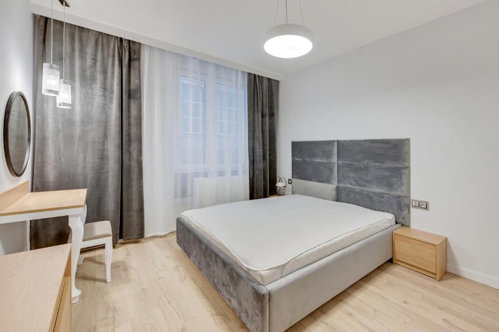 Łóżko lub łóżka w pokoju w obiekcie Comfort Apartments Wilcza
