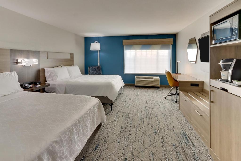 a hotel room with two beds and a television at Holiday Inn Express & Suites - Ardmore by IHG in Ardmore