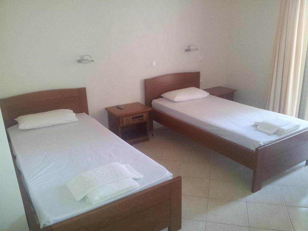 Postel nebo postele na pokoji v ubytování Ostria Hotel