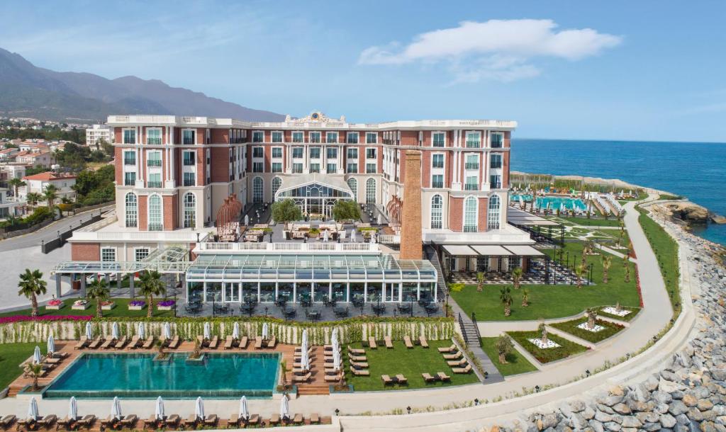 an aerial view of a resort with a pool at Kaya Palazzo Resort & Casino in Kyrenia