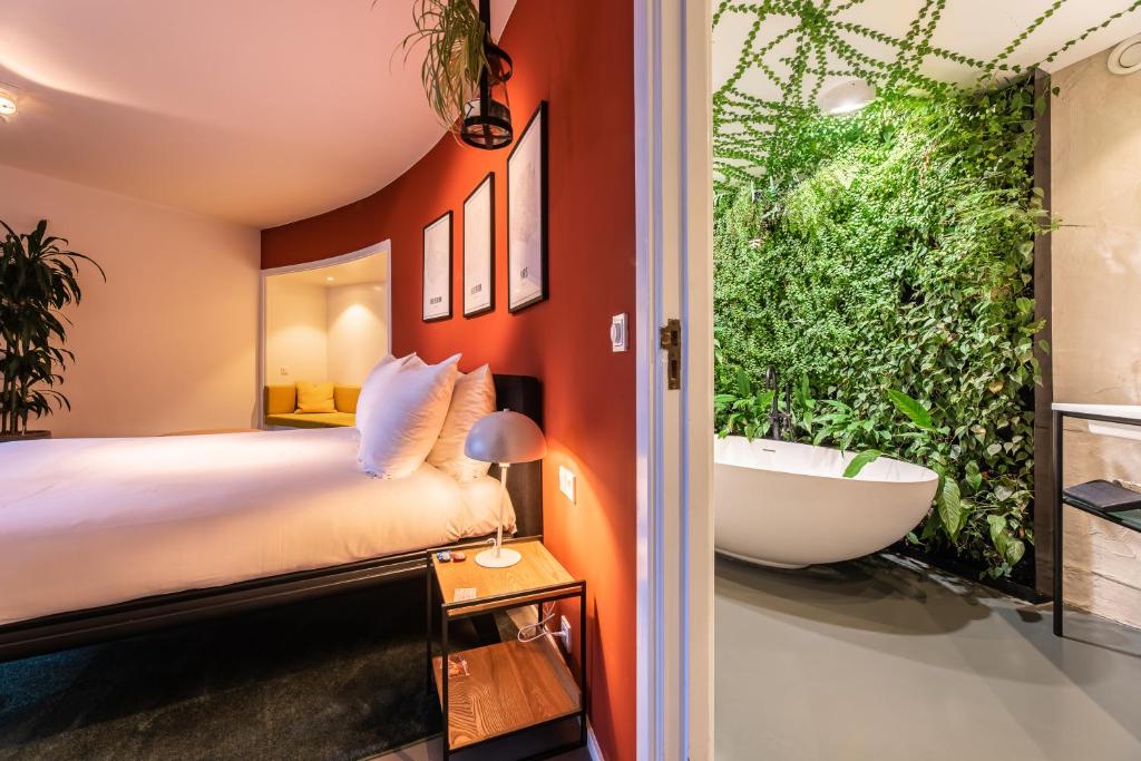 Postel nebo postele na pokoji v ubytování Gooiland Hotel
