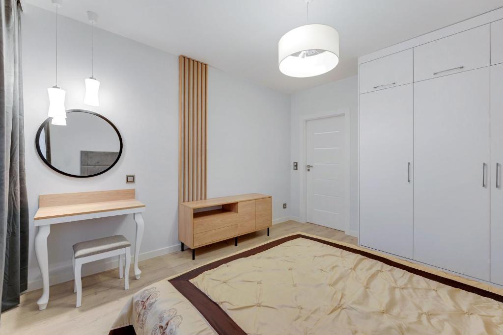 Łóżko lub łóżka w pokoju w obiekcie Comfort Apartments Wilcza