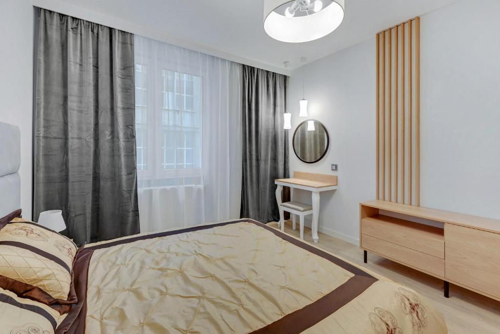 Łóżko lub łóżka w pokoju w obiekcie Comfort Apartments Wilcza