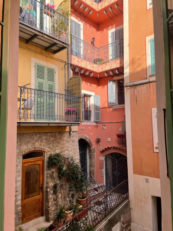 a group of buildings with balconies and stairs at Villafranca in Villefranche-sur-Mer