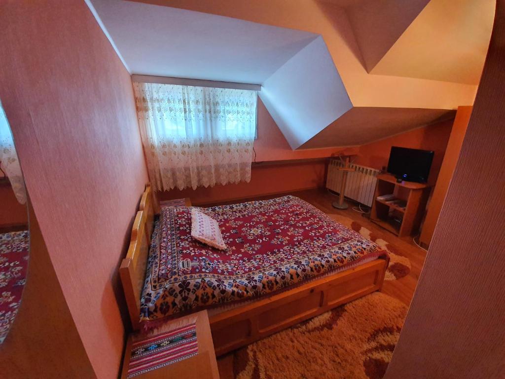 Postel nebo postele na pokoji v ubytování Vila Maya Predeal