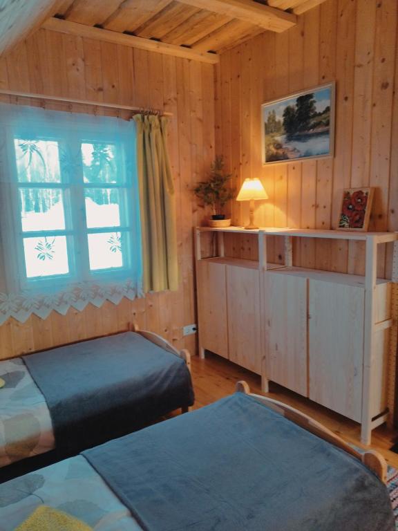 Postel nebo postele na pokoji v ubytování Ausekļu dzirnavu pirts