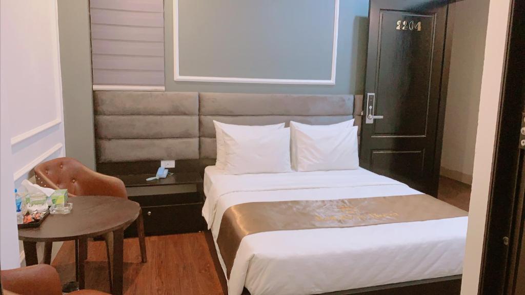 Postel nebo postele na pokoji v ubytování Hotel Red River