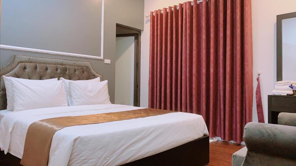 Postel nebo postele na pokoji v ubytování Hotel Red River