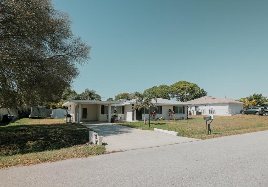 a house on the side of a road at Siesta Vacation Home in Venice