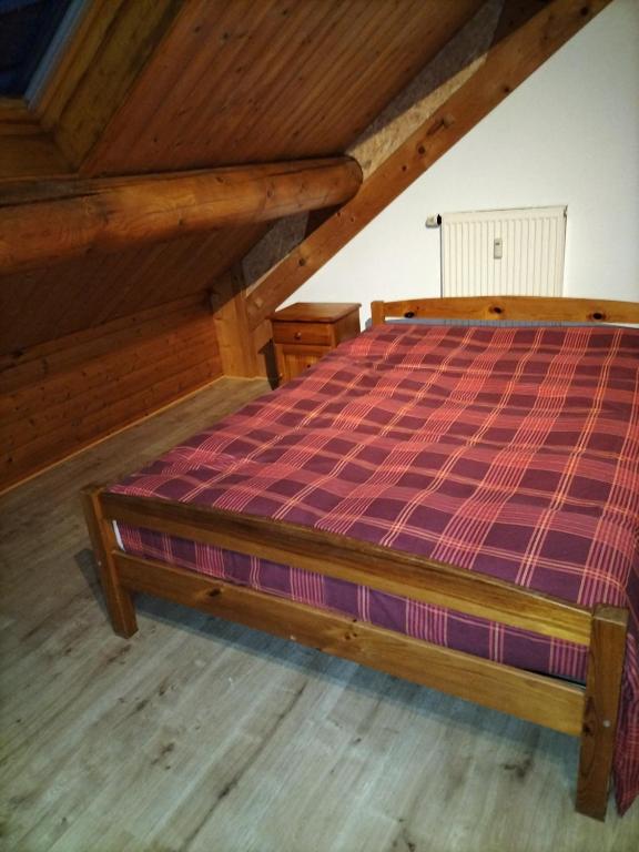 Postel nebo postele na pokoji v ubytování Gîte du Cheval Blanc à Houmont
