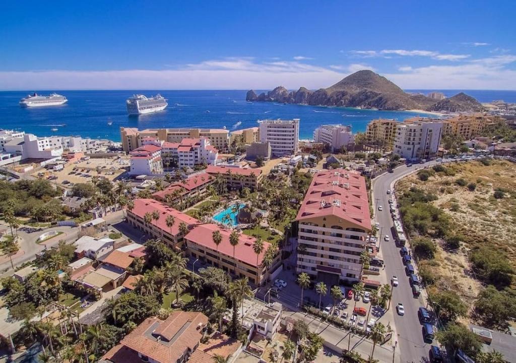 an aerial view of a city and the ocean at Best Location in Medano Beach -Marina Sol LRG 2 Bed Steps to Beach, Downtown & Marina in Cabo San Lucas