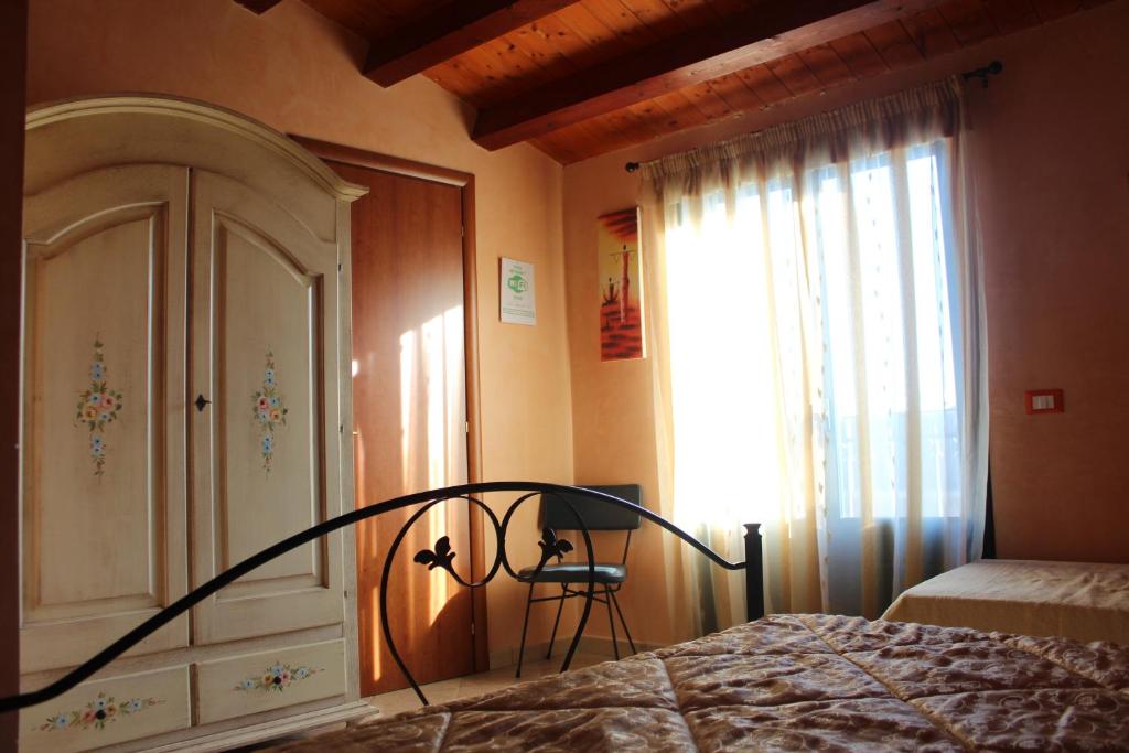 Łóżko lub łóżka w pokoju w obiekcie Agorà-Akrai B&B