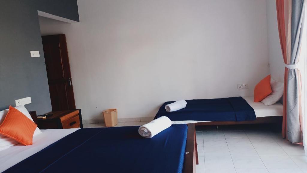 Postel nebo postele na pokoji v ubytování Andorra Tourist Resort Anuradhapura