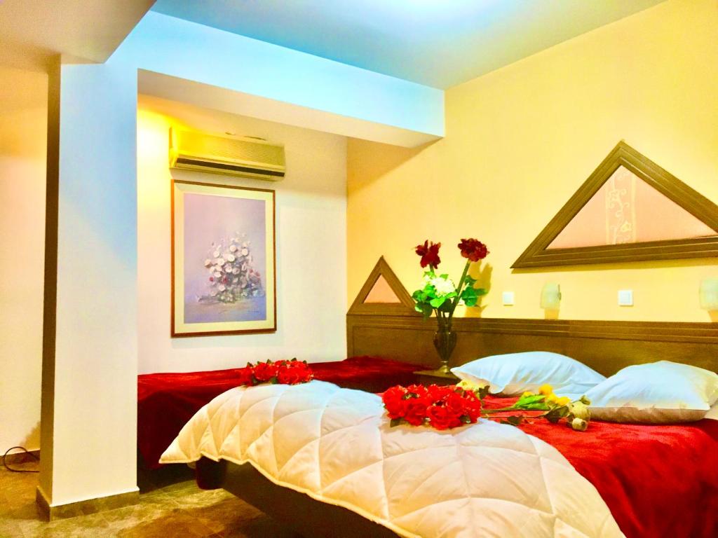 Una cama o camas en una habitación de delphi aiolos center hotel panoramic view&yoga harmony hotel&rooms