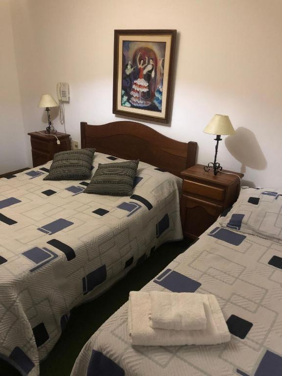 Postel nebo postele na pokoji v ubytování Wiener Haus Hotel