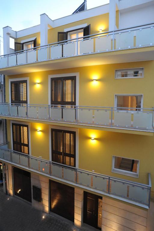 a building with balconies on the side of it at Italiana Resort in Floridia