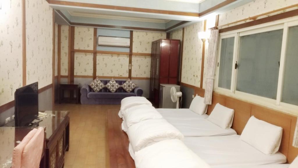 Postel nebo postele na pokoji v ubytování Keton Motel Hualien